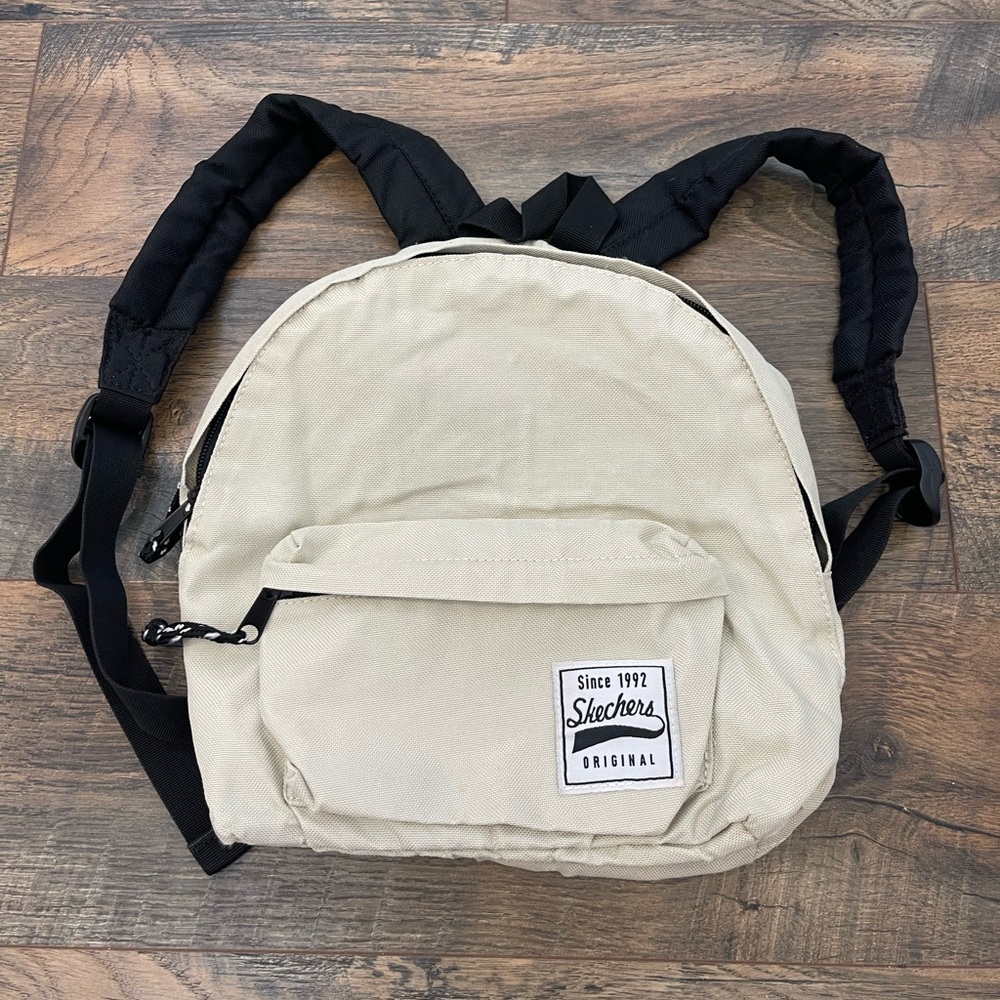 Skechers backpack, light beige and black color.